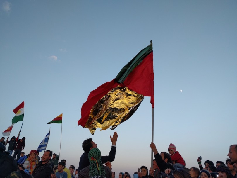 A Kurdish flag made partially from one of the ubiquitous survival blankets of the refugee journey