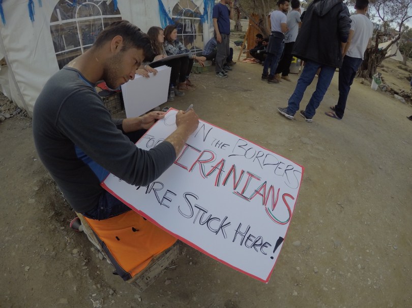 Afghani prepares for a peaceful demonstration at Moria